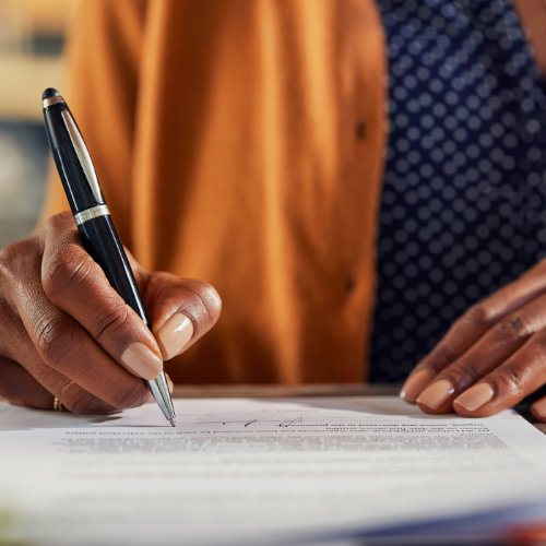 woman filling out paper application
