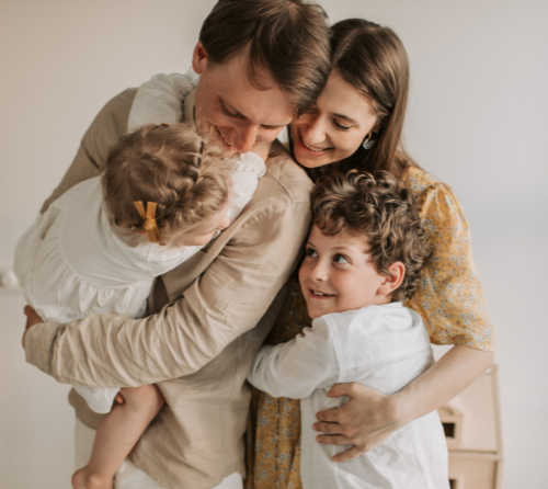 happy family hugging together