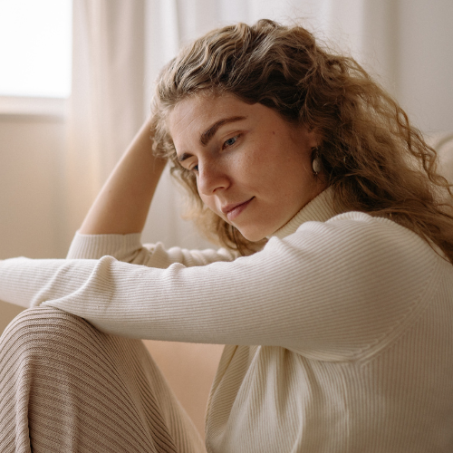 woman contemplating on the ground