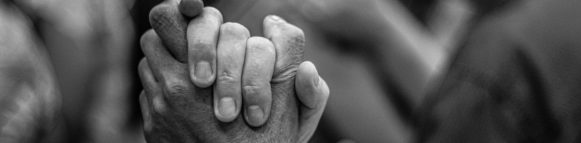 two people holding hands, black and white image