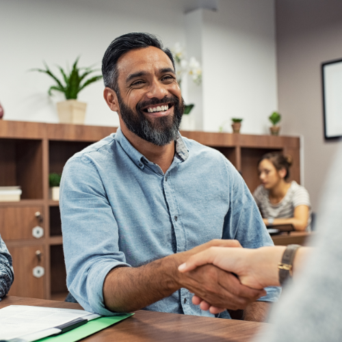 man shaking hand at interview