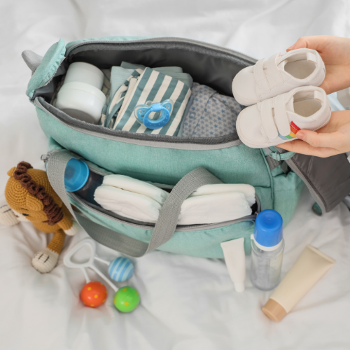 diaper bag with toys and baby resources