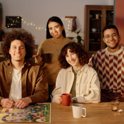 two couples in kitchen smiling