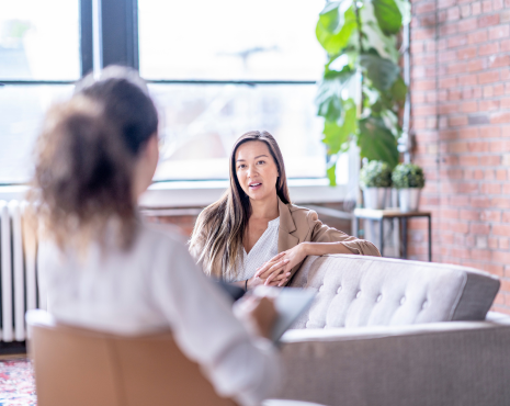 a female counselor talking to her female patient