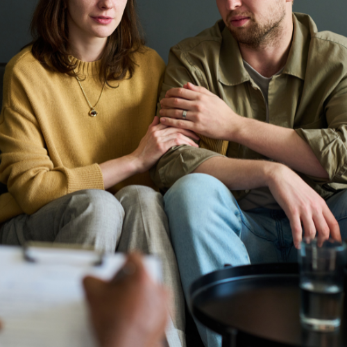 couple sitting together with business professional