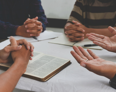 Four people praying