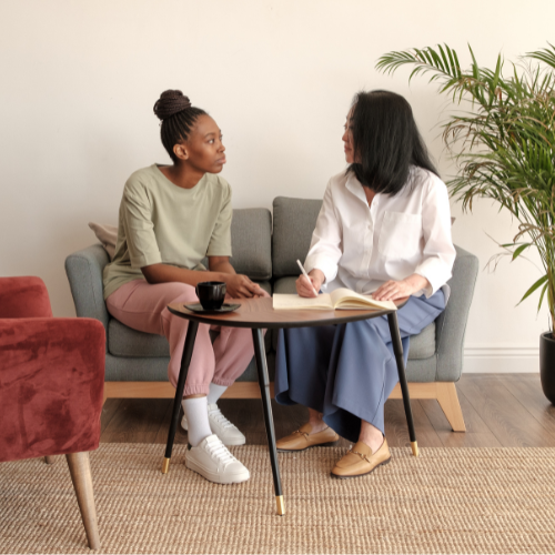 young woman and counselor planning in office