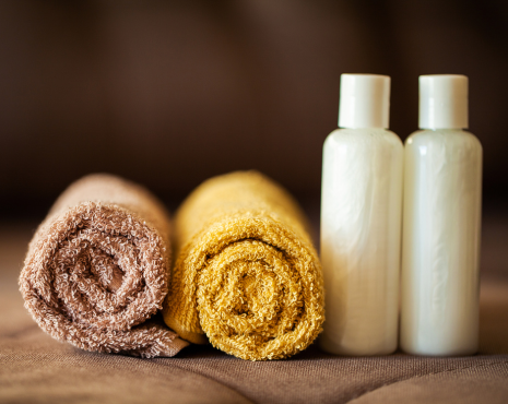 two towels with shampoo bottles