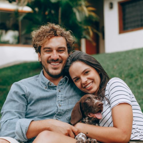 young happy couple with dog