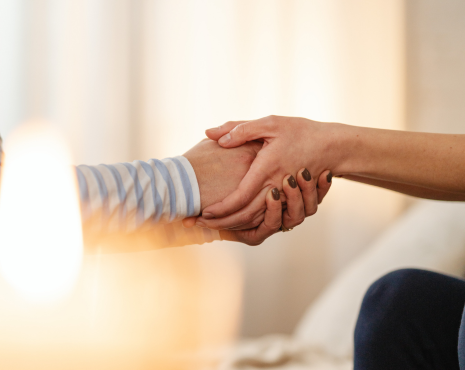 pair of hands holding each other
