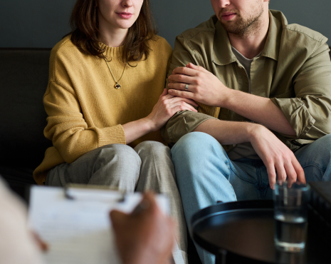 a couple holding each other during counseling
