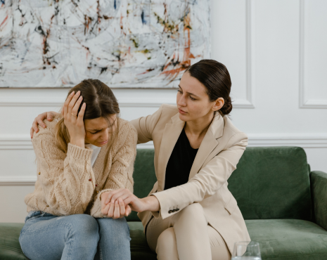 a counselor consoling a patient in distress